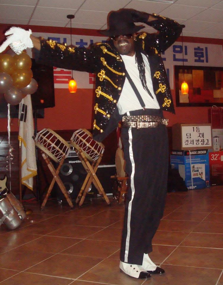 PopaDok performing an expressive Michael Jackson dance tribute pose